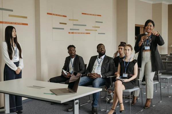 How are UK business services investing in employee training and development?